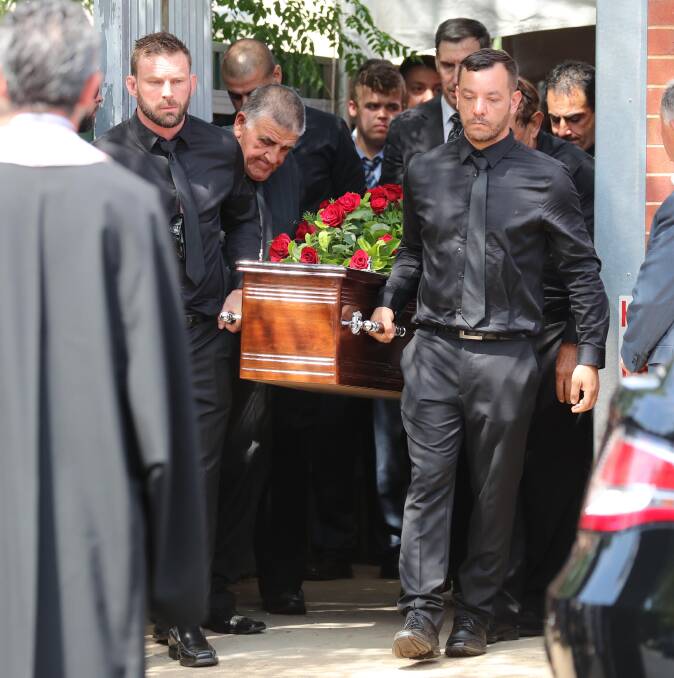 FAREWELL: Nicholas Georgiou, right, at the funeral service for his father, Michael Georgiou, a respected Wagga businessman and community leader.