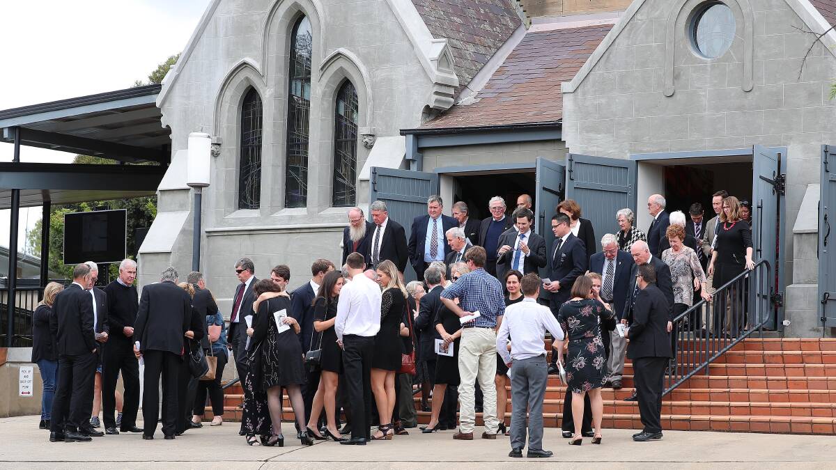 VALE JOE SCHIPP: Family and friends of former Member for Wagga Joe Schipp gather outside St John's Anglican Church after Mr Schipp's funeral service.