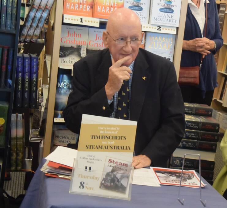 SIGNED COPIES: Tim Fischer, the former deputy prime minister, signs copies of his sixth book. Picture: Jody Lindbeck