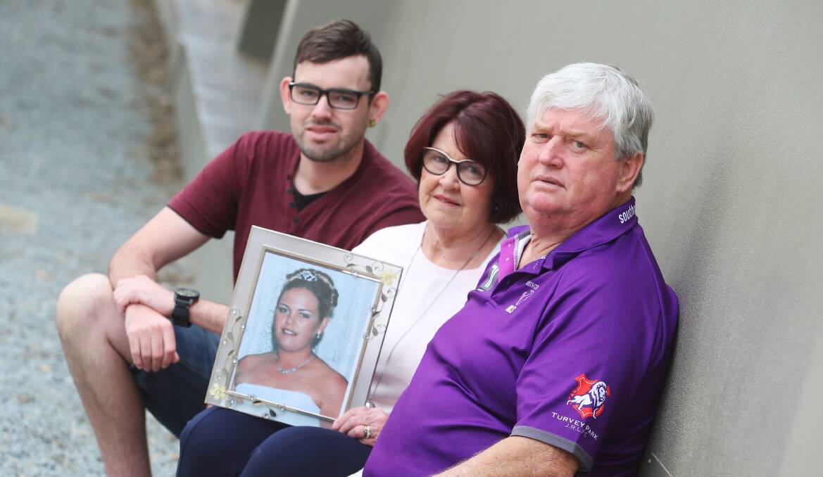 TEN YEARS ON: Tim, Annette and Peter St Clair remember sister and daughter Amie, who died 10 years ago of melanoma when she was just 23. Picture: Emma Hillier