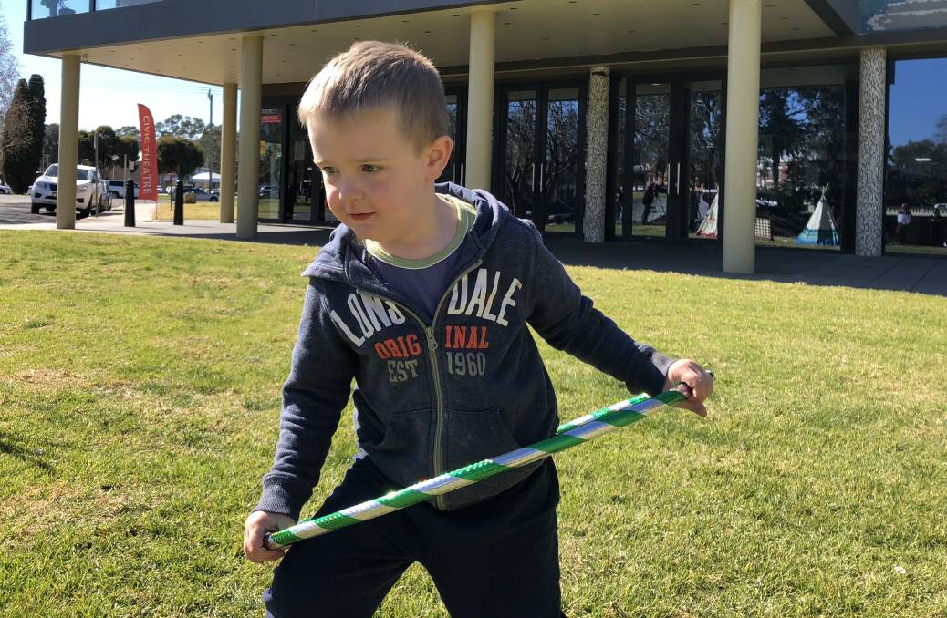 Thomas Whillock, 4, tries out a hula hoop, one of the "old-school" games that will be offered in the chill-out zone at Spring Jam.