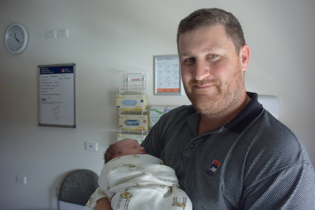 Daryl Cave is pictured with newborn daughter Isabelle Grace. Daryl and his wife Josephine are already parents to two boys, Cooper and Isaac.