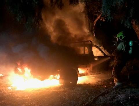 A firefighter extinguishes yet another car fire in Wagga. Picture: Supplied.