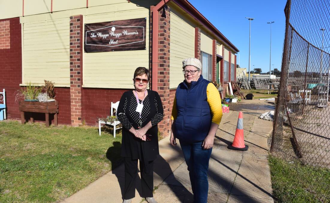 Wagga Women's Shed president Susan Hill and secretary Barbara Vernon-Bowers outside the Beckwith Street premises, where a water pipe has burst. Picture: Jody Lindbeck