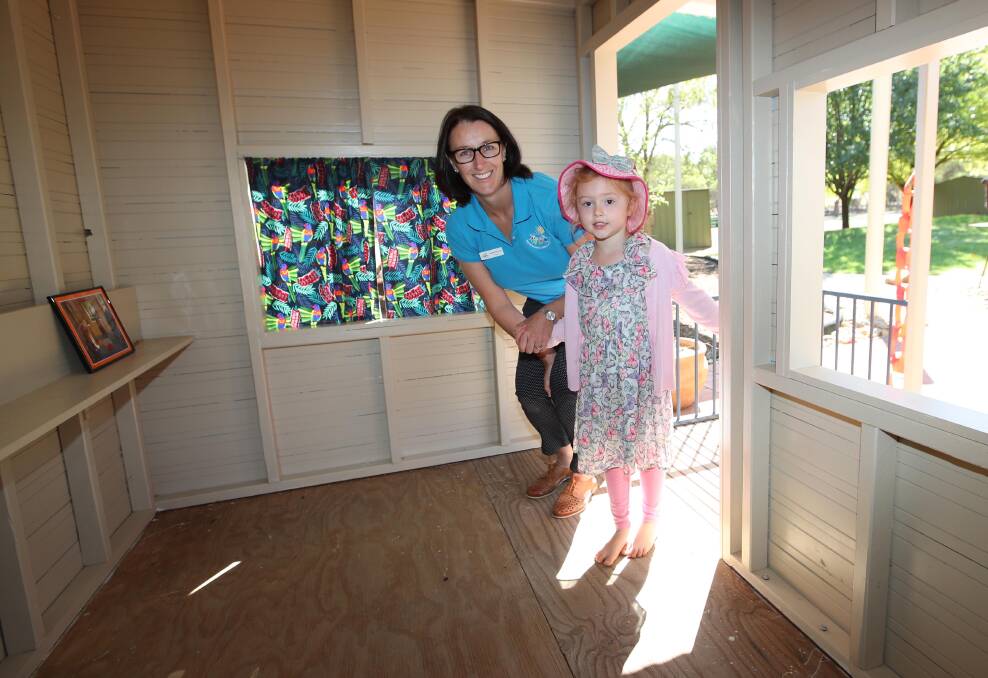 COME ON IN: Centre director Donna Worner and  Maddison Wills, 4, inside the newly installed cubby house. Picture: Les Smith