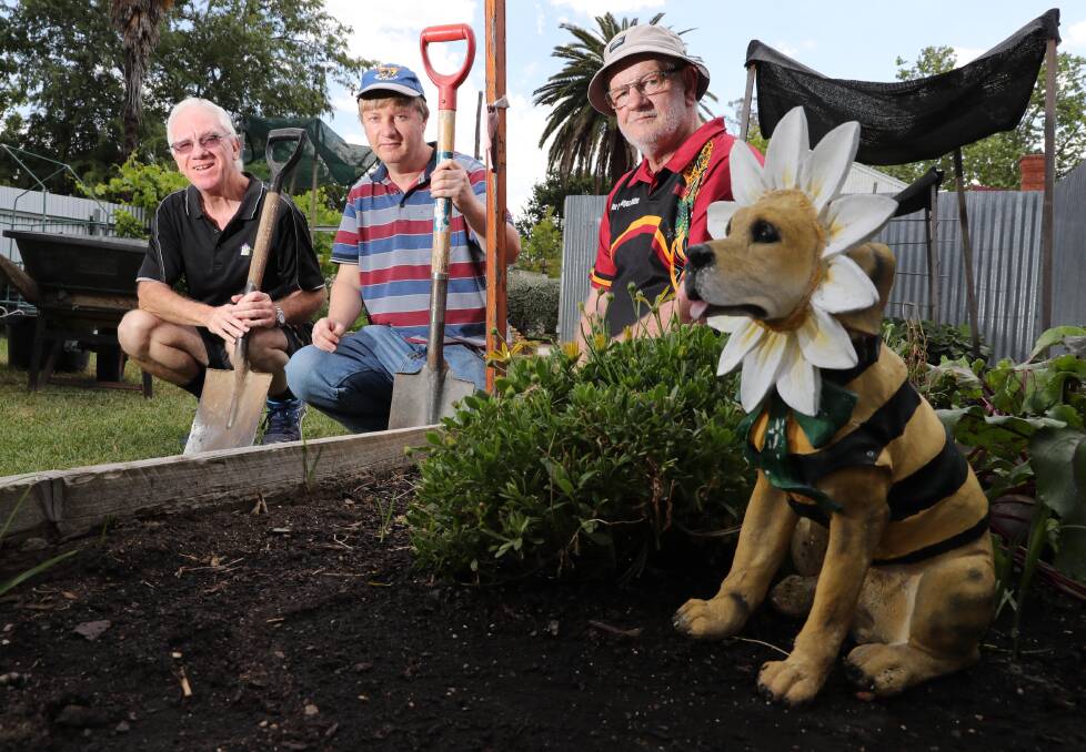 GREEN THUMBS: David Ohlsen, Stephen Hall and Bill Budd in the garden of Sunflower House.