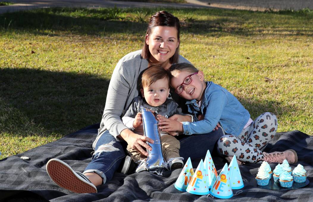 CELEBRATION: Easton Evans, who was born at Wagga Base weighing 5.6 kilograms, with his mum Kate and sister Sienna. Picture: Les Smith