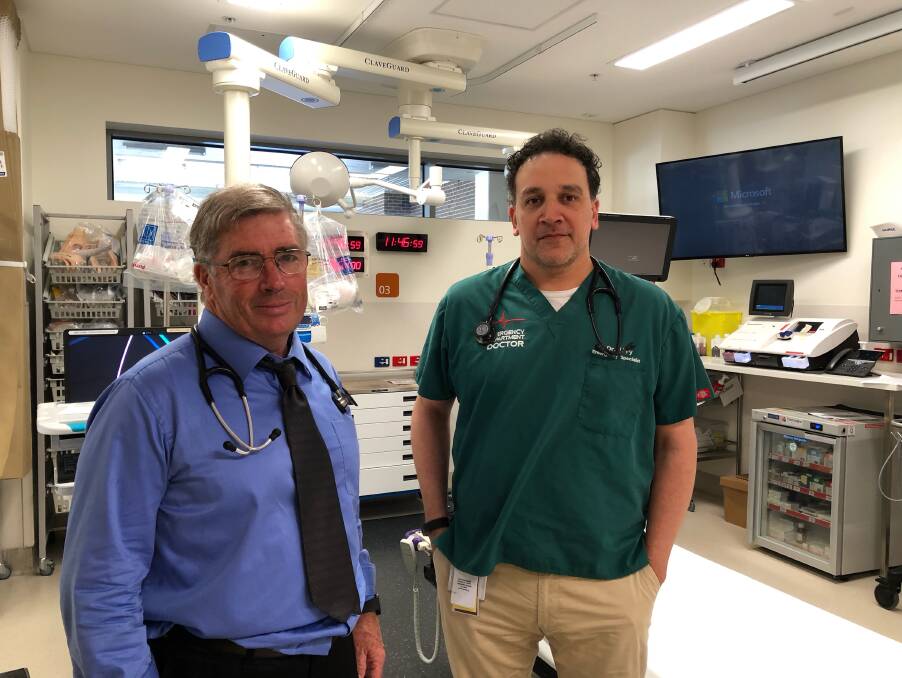 Jeremy Fry, the Wagga Base Hospital's co-director of emergency medicine (right), says violence is an almost-daily occurrence in the emergency department. Dr Fry is pictured in the department with colleague Tom Heaney.