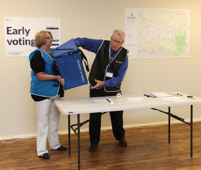 Wagga election manager Darrell Martin and senior office assistant Veronica Dawson, pictured here at the ballot draw, will be in for a busy weekend.