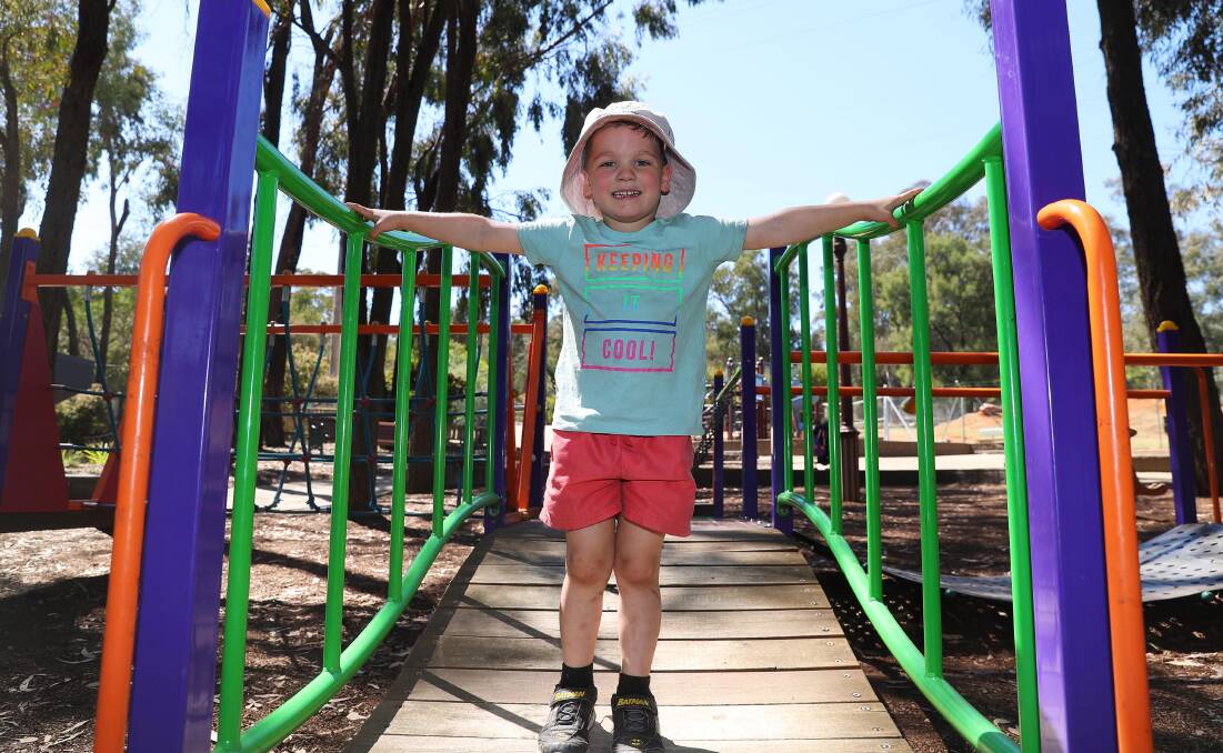 Eli Watson, 5, from Wagga, was set to beat the heat with a big hat and a shady play area. Picture: Emma Hillier.