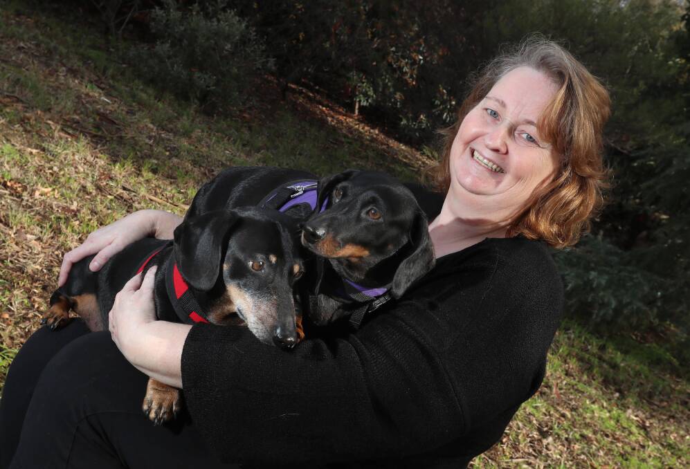 Anne Peck, with her dogs Bonnie and Frankie, who have both been desexed