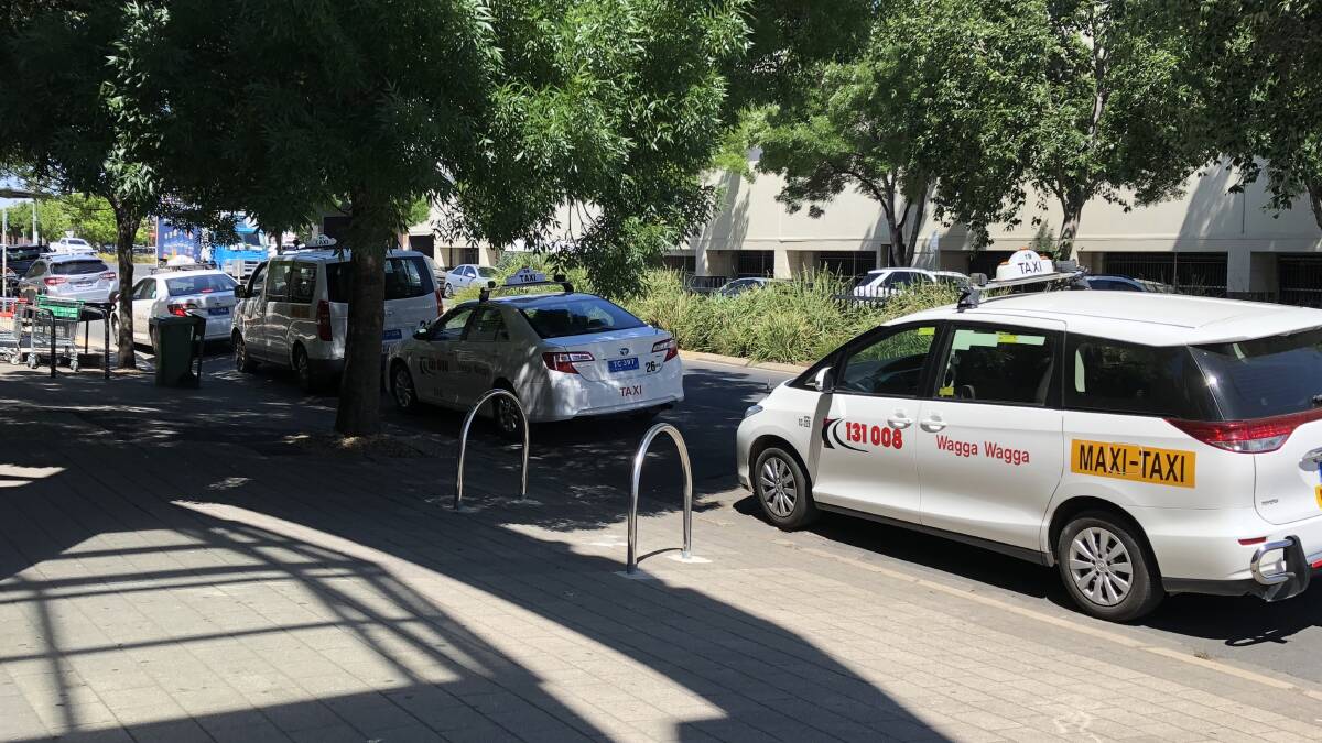 WAITING GAME: Traditional licensed Wagga taxis wait for fares between the Sturt Mall and Wagga Marketplace, the day after Uber announced it would bring ride-sharing to Wagga. Picture: Jody Lindbeck