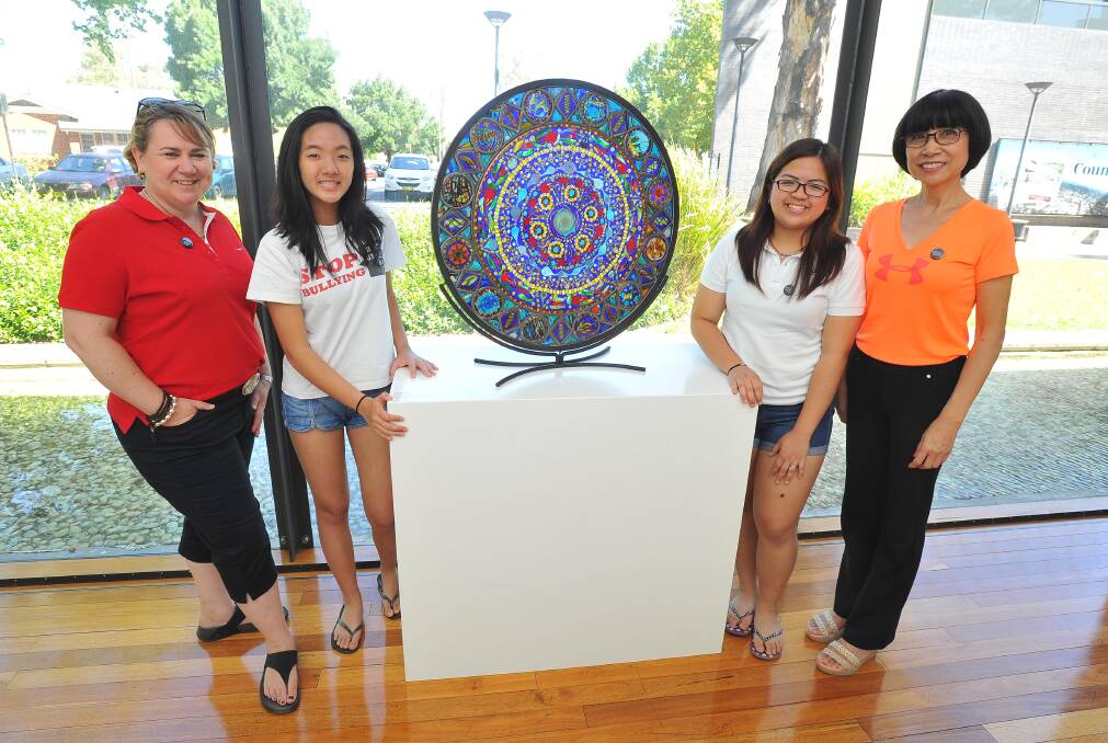 Expat Sally Lean, a former Wagga woman, is pictured during a 2016 visit to the Wagga Glass Art Gallery with some international students.