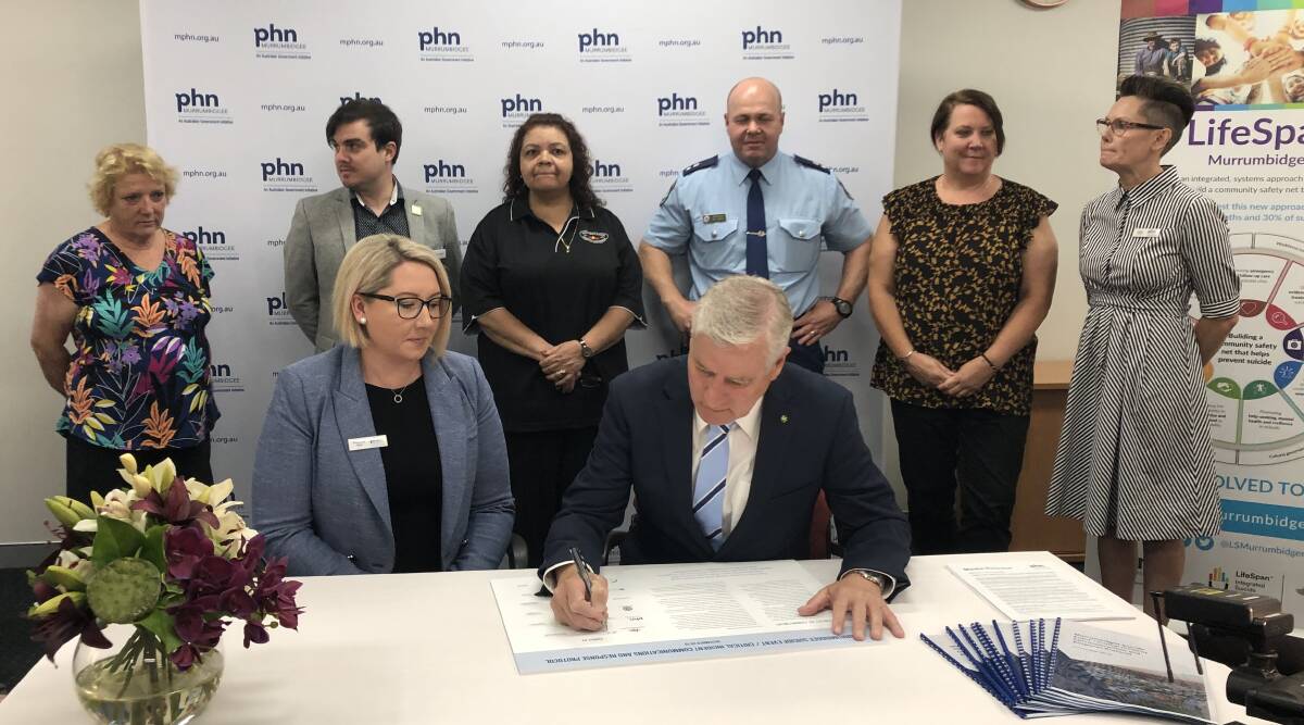 Melissa Neal, the chief executive officer of the Murrumbidgee Primary Health Network, and Deputy Prime Minister Michael McCormack were among those to sign up. Picture: Jody Lindbeck