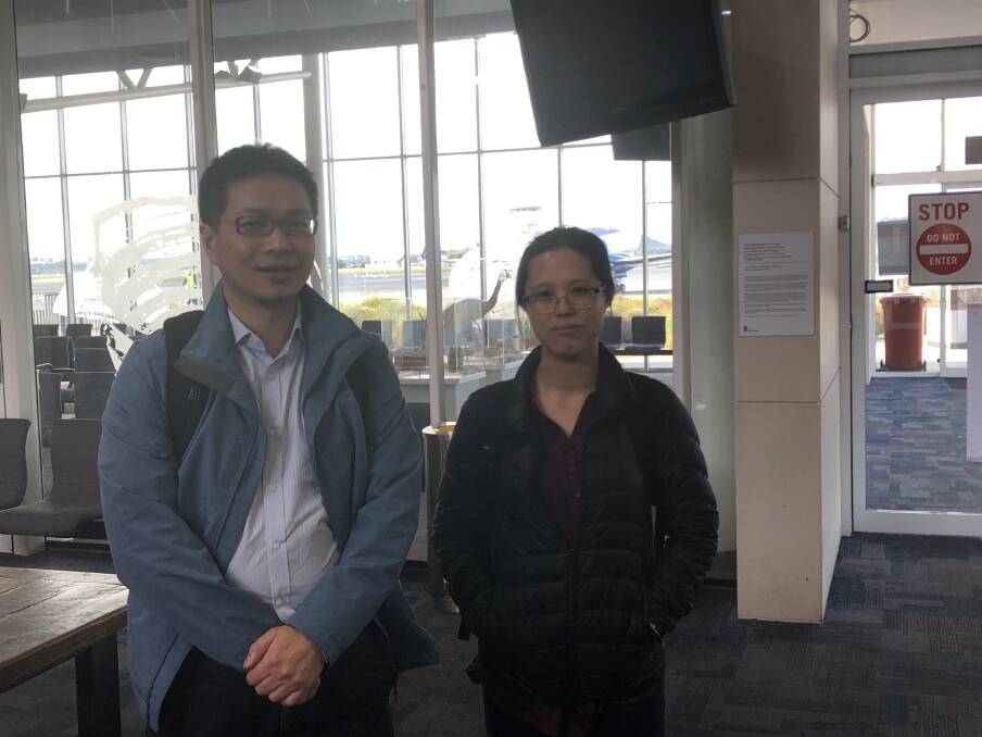 Visiting mental health clinicians Michael Hong and Elaine Kwan, in the otherwise deserted Wagga airport terminal.