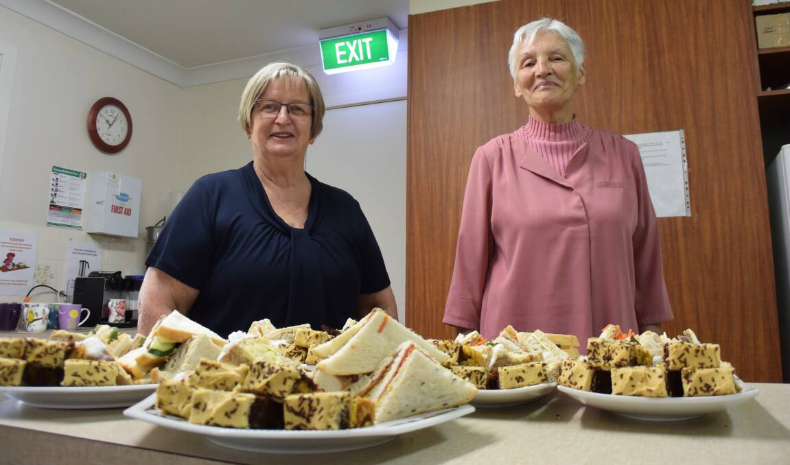Therese Noonan and Val Ovington prepare the food for the "cafe" part of Memory Cafe.