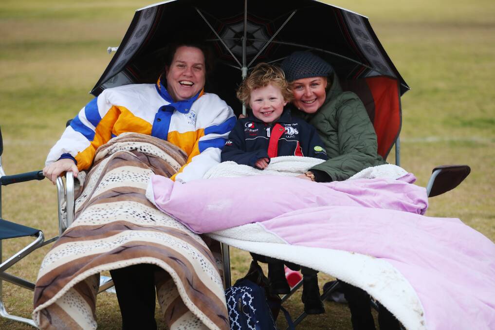 BUNDLED UP: Kate Timothy-Nesbit, Jackson, 5, and Sharyn Nimmo, were rugged up against the chill.