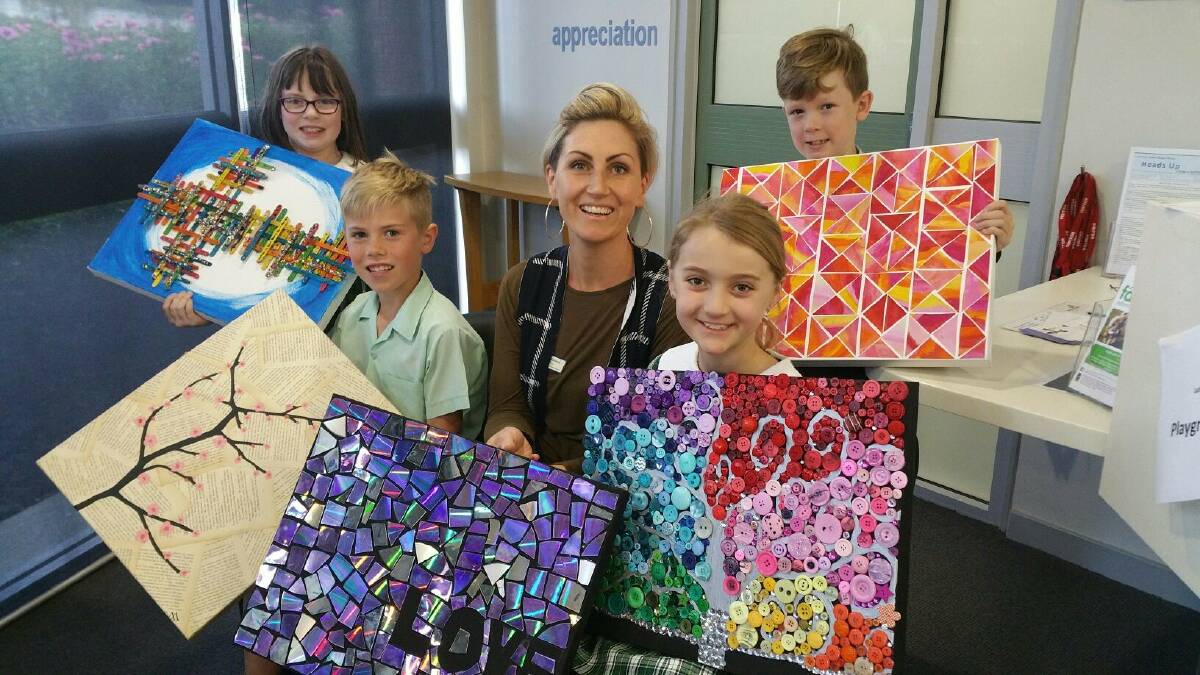 FESTIVAL TIME: Lutheran Primary School year 3 teacher Tash McLeod and pupils, Casey Clark, Vaughn Jenkins, Rebekah Law and Archie Cronk, all 9, with showing some of the artwork that will be on sale at the festival. 