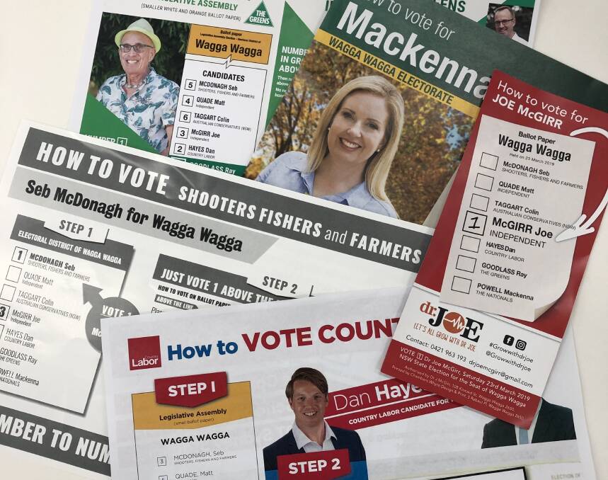Some of the how-to-vote cards currently being handed out in Wagga, with the opening of pre-poll voting ahead of the state election on March 23.