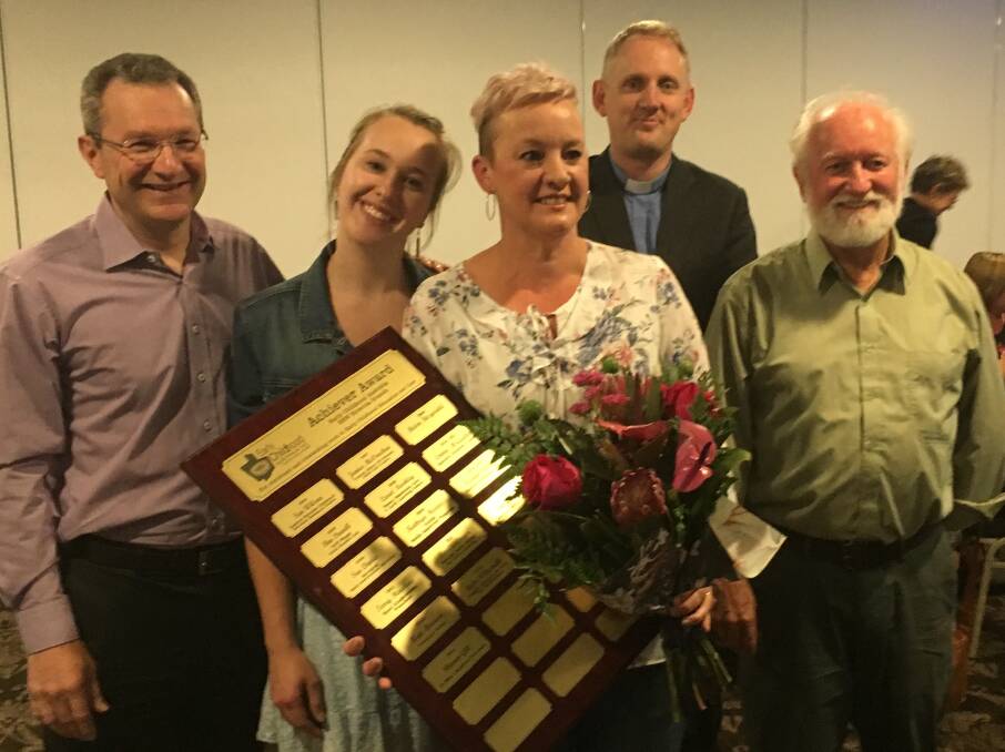 Family and friend, Lincoln Gill, Jess Gill, Reverend David Ruthven and James Hamilton congratulate Sharon Gill on her award.