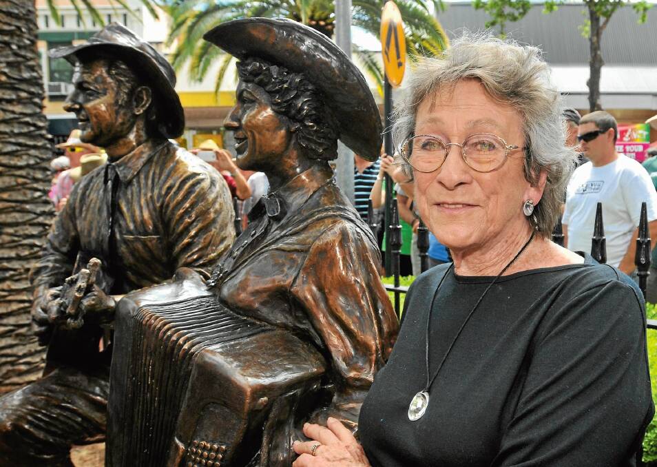 NATIONAL TREASURE: Joy McKean, with the statue of herself and Slim Dusty during a past visit to Tamworth. Picture: Geoff O'Neill 