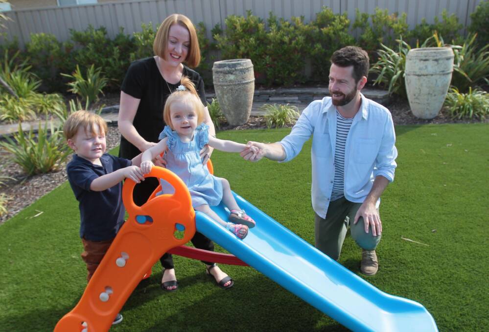 NEW START: The Robertson family - Scott, Charlie, 3, Lila, 12 months, and Michelle inside their Wagga home. Picture: Les Smith