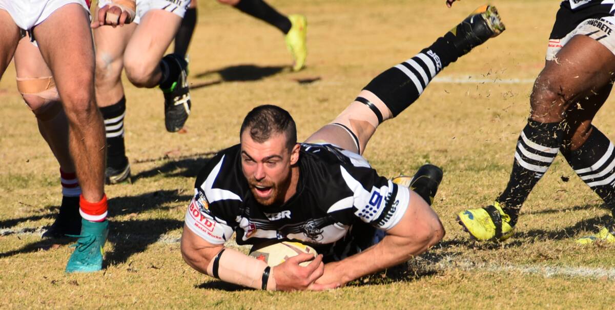 John Grant crashes over for a try while playing for Cowra Magpies in Group 10.