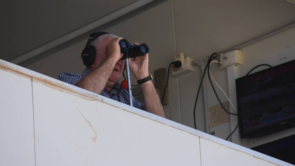 Stuart Maxwell calls the action from the broadcaster's box at the Young Paceway. 