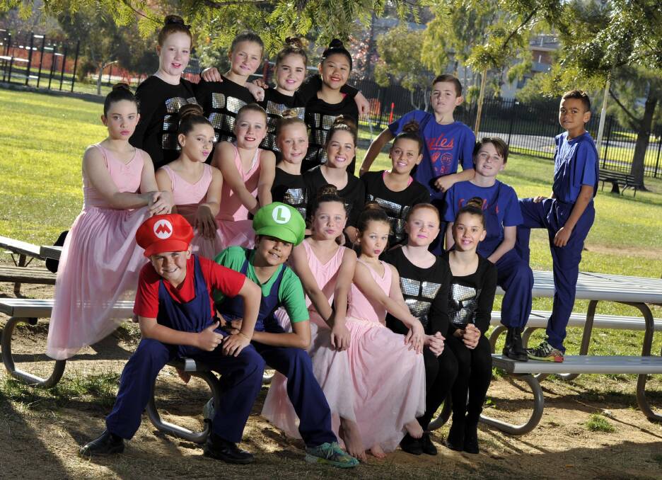 The Sturt Public School cast of Super Mario prepare for the Riverina Dance Festival at Albury on Friday. 
(From left) seated: Jeremy Piercy, Tyrone Bethaly-Murray, Chelsea Tomlinson, Jorja Pinney, Hannah Nielson and Ashleigh O'Halloran.
Middle: ChelseaApps, Charlotte Burton, Ruby Gillard, Ruby Thornley, Ava Vincent and Makaylee Little.
Back: Georgia Upton, Fiona Smyth, Hayley Doyle, Delmari Cenojas, then the plumbers (L) Sam McNaughton, Macauley Armstrong and Will Parker.