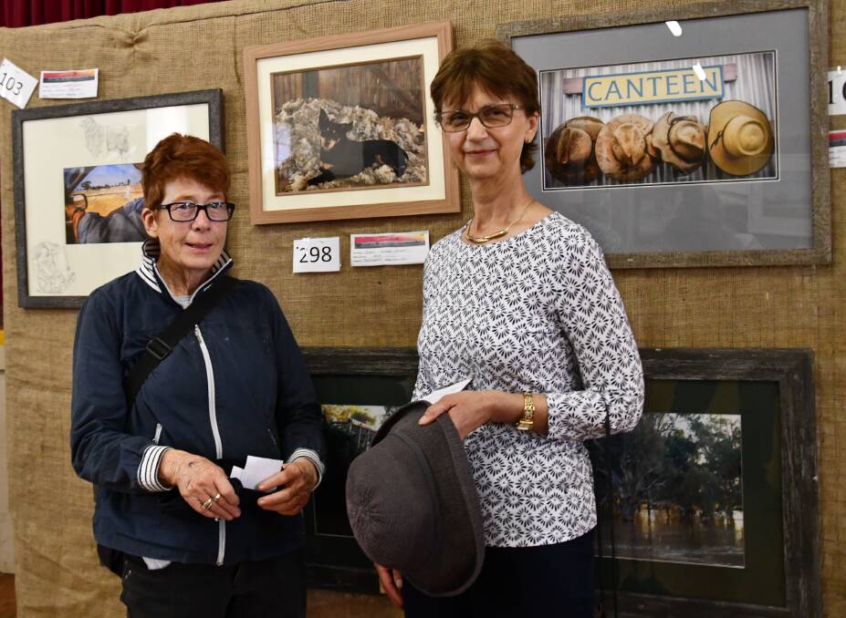 Annette Wheaton and Julie Webber from Wagga Wagga enjoying the artwork at last year's event. 