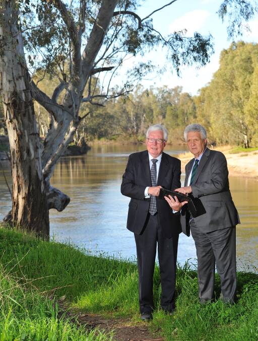 TIDE IS HIGH: Industry heavyweight Dallas Booth met with Wagga insurance broker Peter Brown to discuss the need for urgent flood prevention action. Picture: Kieren L. Tilly