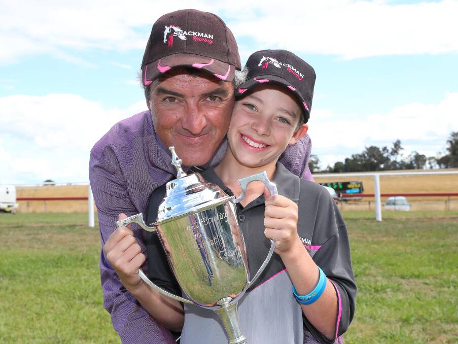 WINNERS ARE GRINNERS: Winning trainer Scott Spackman with his son Oliver Spackman celebrate the win by Won by number 6 'Didn't Even Kiss Me' ridden by Wendy Peelat the Tumbarumba Cup. 