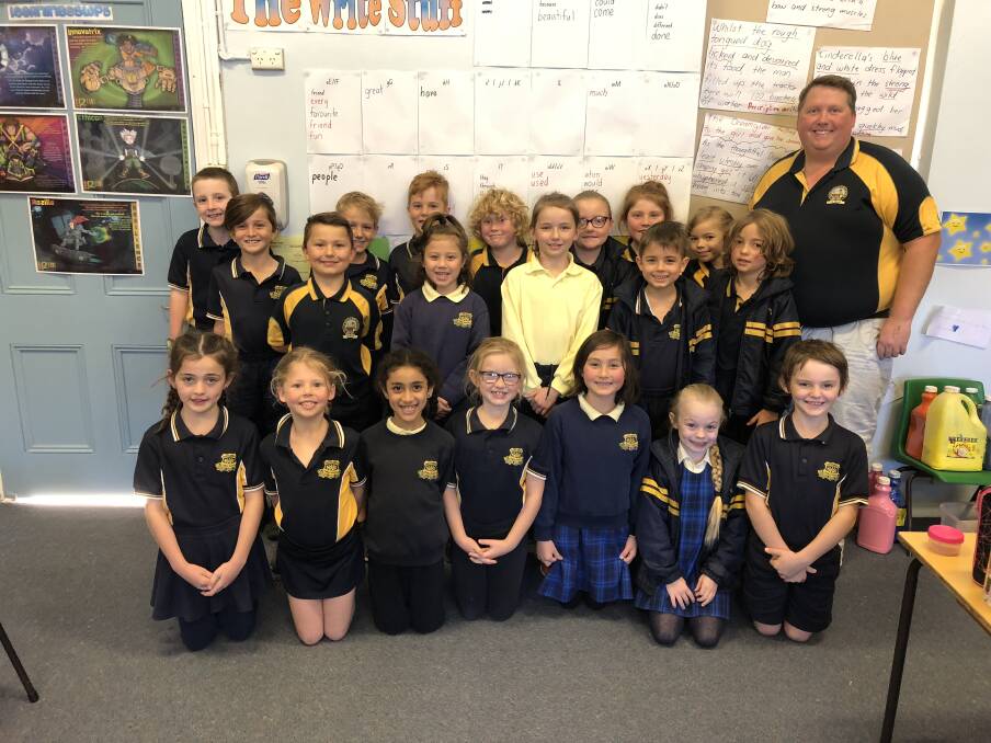 SAY CHEESE: Mr Harris (top-right) and his Grade 2 Goanna students were excited to participant and say what they love most about their teacher. 
