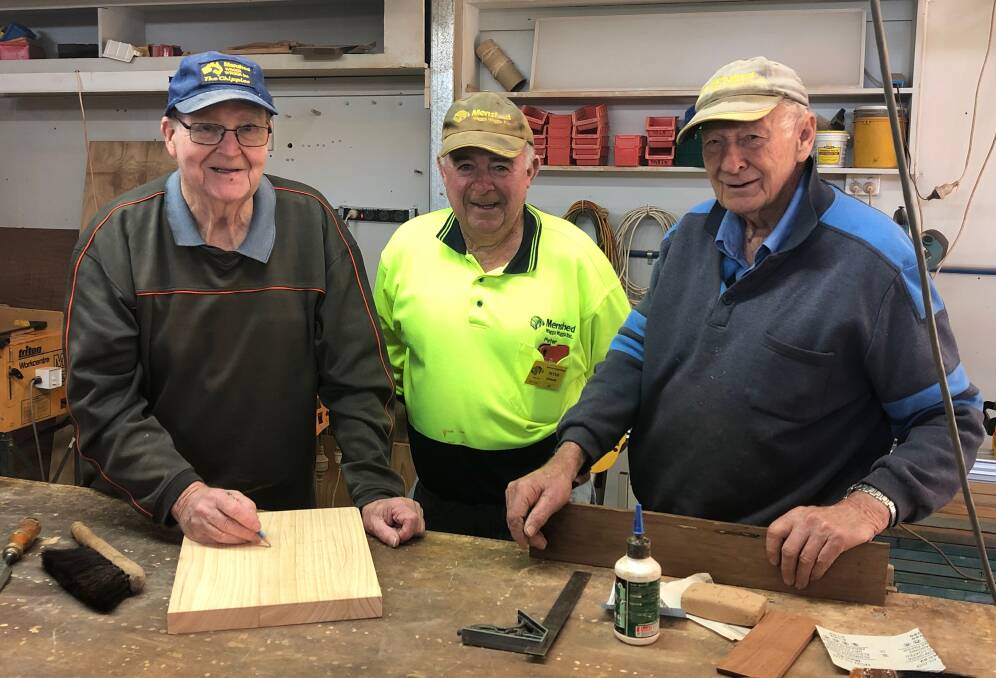 SECOND SHED: Wagga Men's Shed members Kevin Thompson, president Peter Quinane and John Mason working on bits and pieces. Picture: Jess Whitty