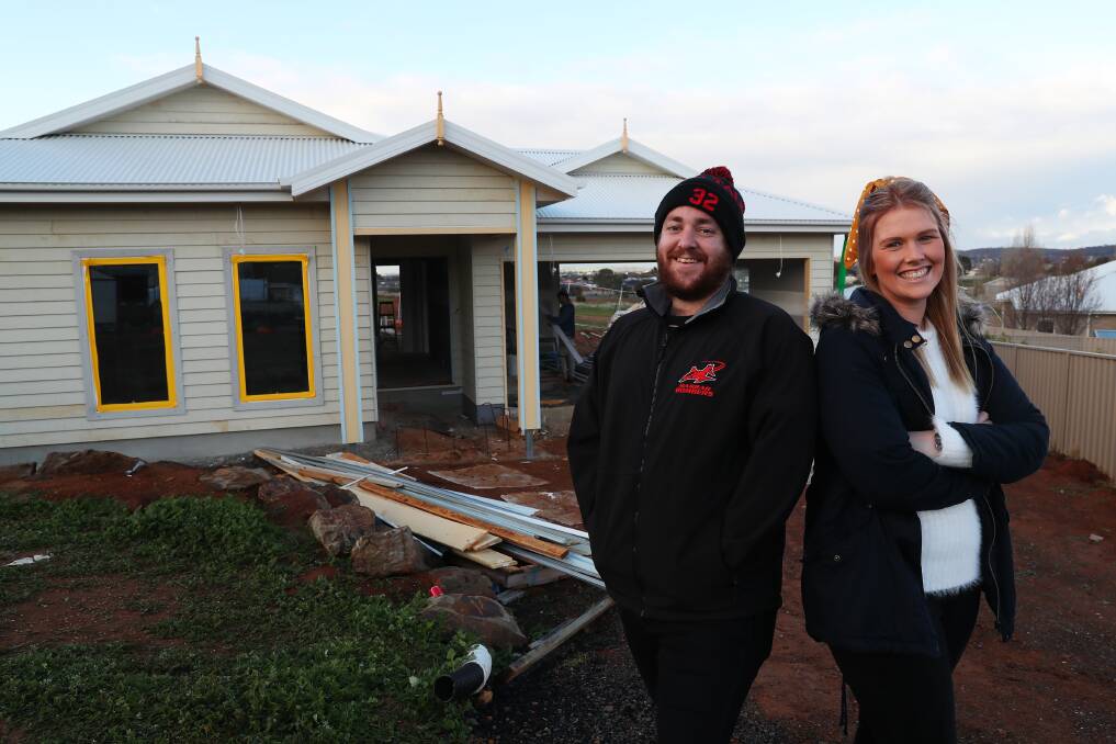 BUY OR BUILD: Sophie Hawkins and Josh Malone say they're excited to move into their new Lloyd home in mid-September. Picture: Emma Hillier