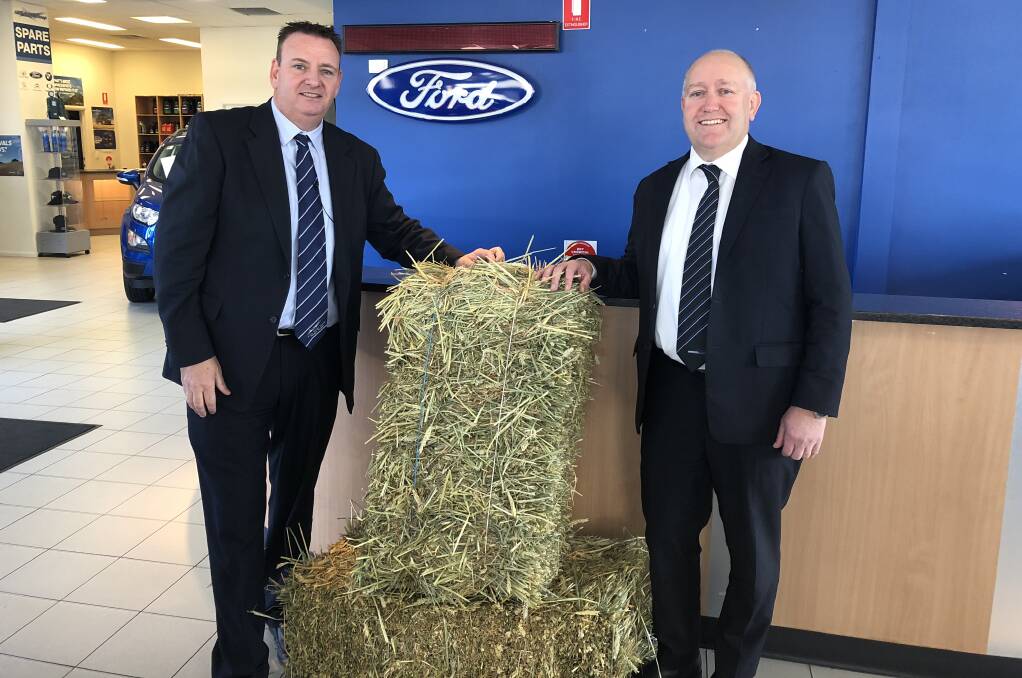 REACHING OUT: David Kelly owner of the Hillis Motor Group and the Riverina Motor Group's owner, Dale Isaac, jumped on board to help drought affected farmers. Picture: Jess Whitty