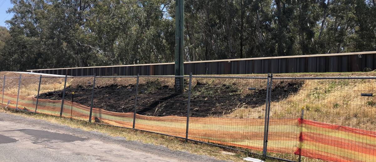 QUICK ACTION: Turvey Park Fire Station crew races down to extinguish grass fire on the side of the levee bank. Picture: Jess Whitty