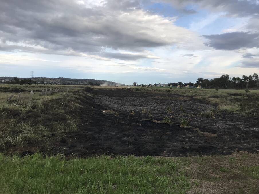 AFTERMATH: Emergency crews were called to Tasman Road, Wagga's east, last night after a grass fire burned. Turvey Park fire station's officer Justin Bentley said it is being treated by the police. Picture: Jess Whitty 