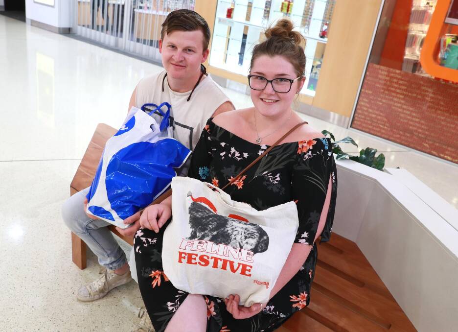 DAY OUT: Tumut residents Liam Breed and Micaela Piper make the trip up to Wagga each year for their Christmas shop. Picture: Les Smith
