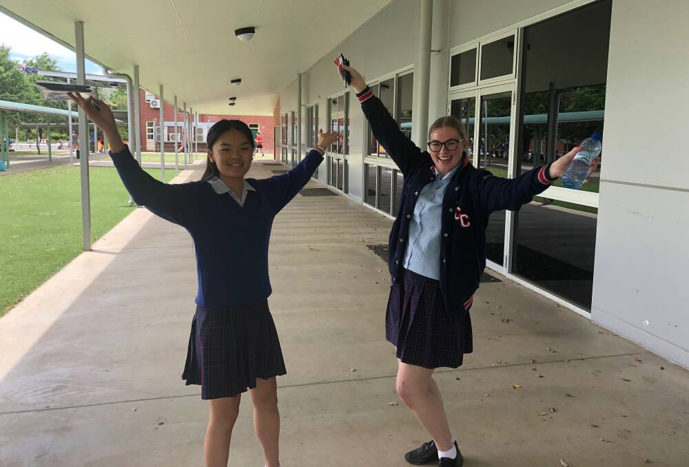 HOORAY: Three weeks of HSC exams have concluded and Kildare Catholic College Year 12 students Amy Li and Molly Garry celebrated as they walked out of the drama exam. 