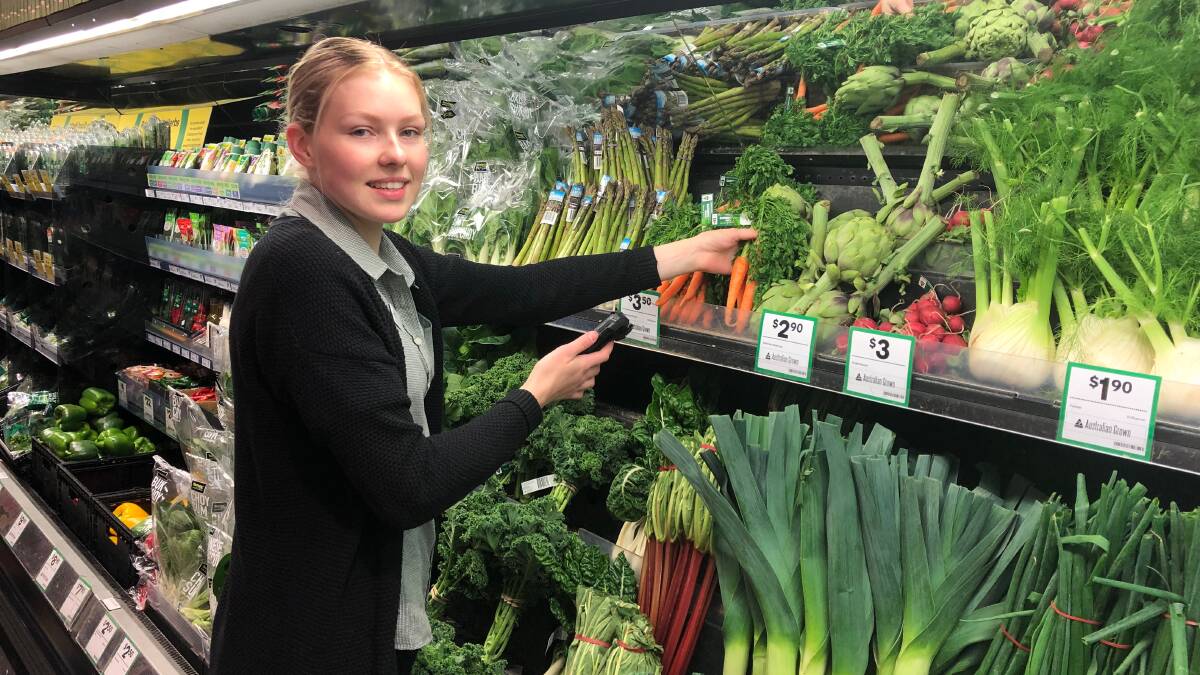 ONLY THE BEST: Woolworths on Gurwood Street personal shopper Ivy Seddon is picking produce for those choosing to shop their groceries online. 
