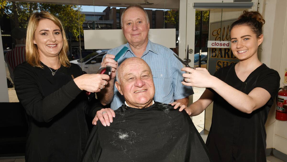 FAMILY RUN: Raelene Smith, Brian Elliott and Darcie Smith are working on Kevin Wales' head at Elliot's Barbershop, on Baylis Street, which has entered its next generation. 