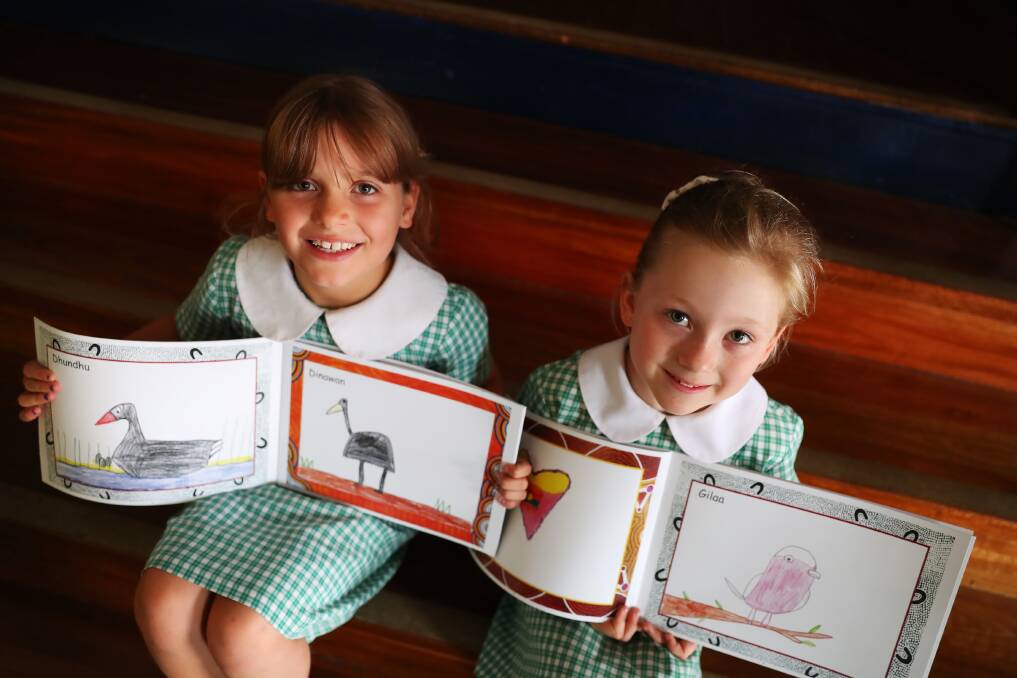 FOSTERING LANGUAGE: Turvey Park Public School year 2 students Paige Bryon, 7 and Annie McKelvie, 7, learnt and created a Wiradjuri picture book. Picture: Emma Hillier