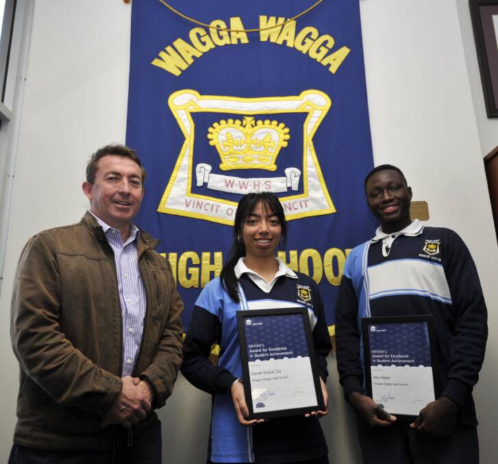 TOP RANK: Technology teacher Scott Trenaman and year 12 students Sarah Grace Zia and Abu Kebe, were three of four awards presented to Wagga High School by the Minister of Education. Picture: Chelsea Sutton