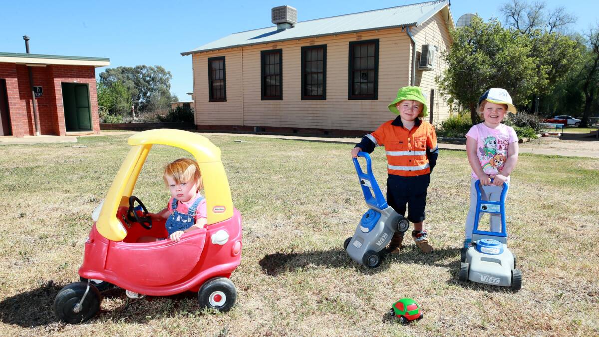 CHILDREN RUN WILD: Daisy Pereira, 2, Tate Cedelland, 4, and Elsie Shephard, 3, hope in a few years they can call this school theirs. Picture: Les Smith

