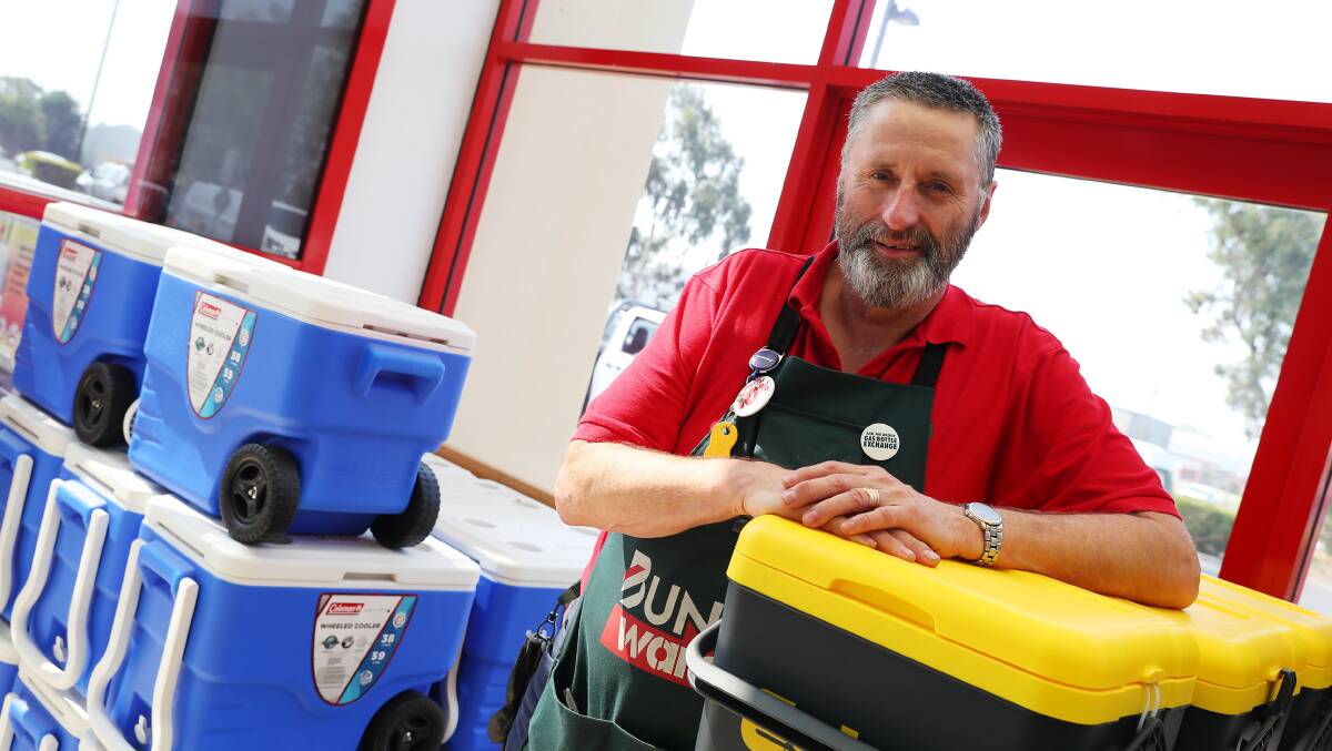 SELLING HOT: Wagga's Bunnings Warehouse employee Andrew Sanders is constantly restocking fans, air conditioners and eskies which are flying off the shelves as the community readies for a scorching few days. Picture: Emma Hillier