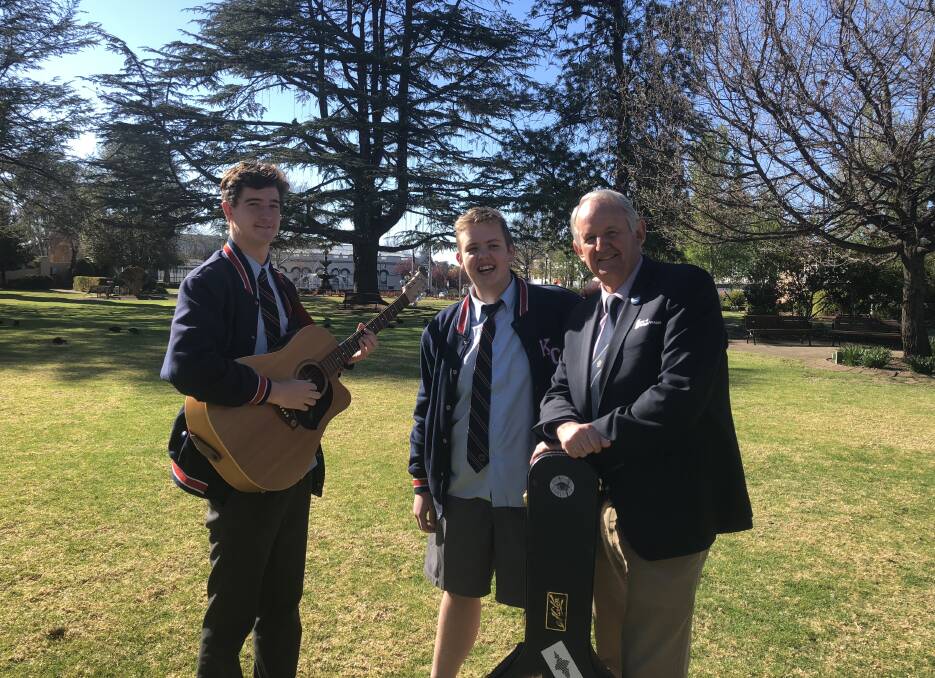 REACHING OUT: Kildare Catholic College year 12 students Thomas Brereton, 18, and Harry Mangelsford, 18, with mayor Greg Conkey, will be among local musicians uniting together at Sunday's supportive community event. Picture: Jess Whitty