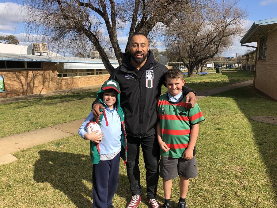 CHEESE: Ashmont Public School students and dedicated Rabbitohs supporters, Tylah Barby, 9, and Caleb Thomsen, 10, were excited to have Roy Asotasi visit the school. 