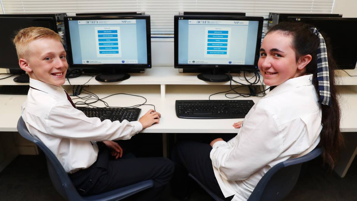 RELAXED STUDENTS: Wagga Christian College year 7 students Michael Linn, 12 and Rebekah Hector, 13 say they're not worried about the NAPLAN testing that kicks off today. Picture: Emma Hillier