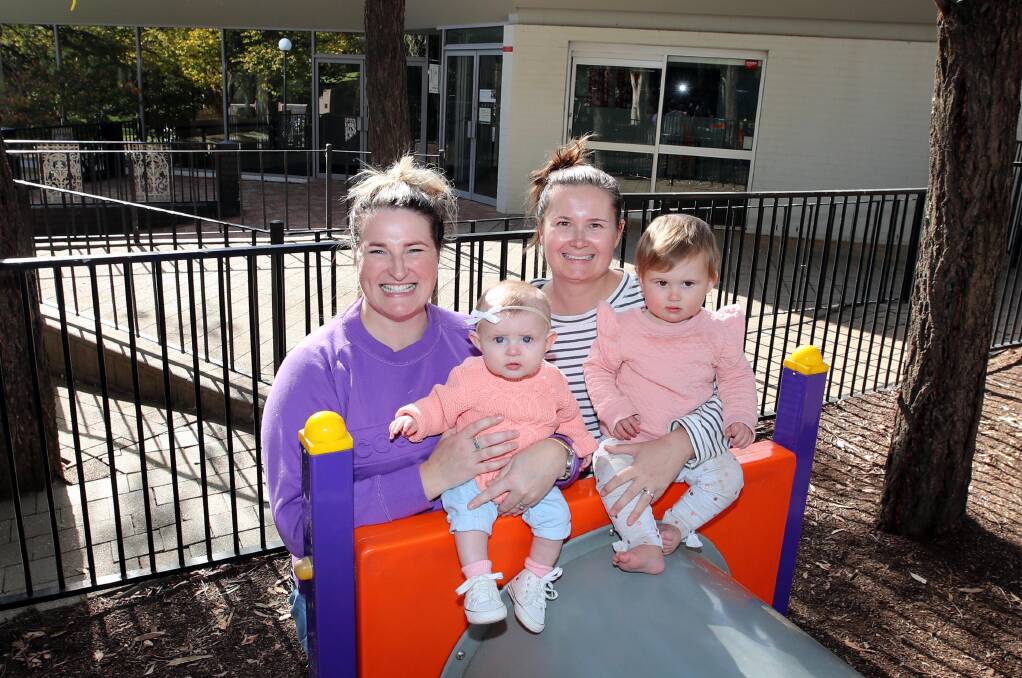 NEEDED: Kristi Andrews with Lainey, five-months-old and Tara Durbridge, with daughter Eadie, 1, say they would love to see a new cafe at the Botanic Gardens. Picture: Les Smith
